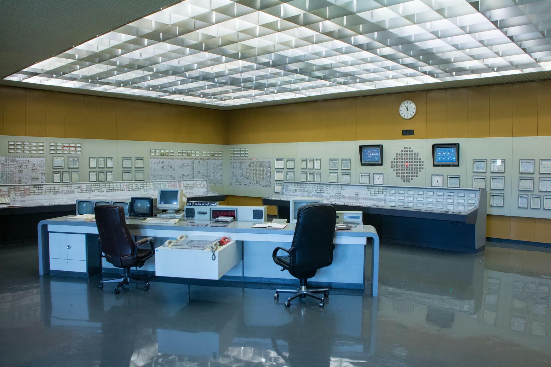 Traditional water treatment plant control room with SCADA panels, CRT monitors, and analog gauges — representative of where most utilities stand today